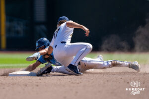 West Virginia Mountaineers Matt Ineich (17) tags out North Carolina Tar Heel Gavin Gallaher (5) in the eighth inning during a CWS game on June 17, 2026, in Omaha, Nebraska. Photo by Brandon Tiedemann.