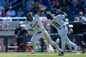 West Virginia Mountaineers Armani Guzman (5) and Tyrus Hall (8) both look for a pop fly in the eighth inning during a CWS game on June 17, 2026, in Omaha, Nebraska. Photo by Brandon Tiedemann.