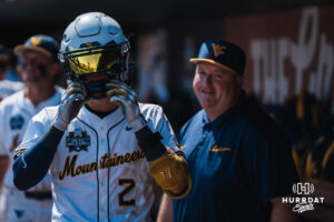 West Virginia Mountaineers Gavin Kelly (2) celebrates a home run in the seventh inning during a CWS game on June 17, 2026, in Omaha, Nebraska. Photo by Brandon Tiedemann.
