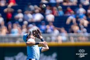North Carolina Tar Heels Jake Schaffner (2) catches a pop fly in the ninth inning during a CWS game on June 17, 2026, in Omaha, Nebraska. Photo by Brandon Tiedemann.
