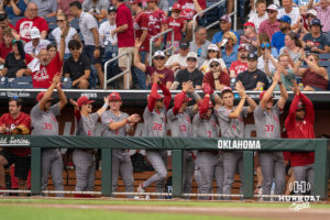 Oklahoma Sooners clap during a CWS game on June 20, 2026, in Omaha, Nebraska. Photo by Brandon Tiedemann.