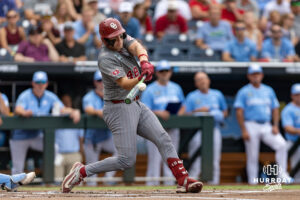 Oklahoma Sooner Deiten Lachance (48) hits a two-run home run against the North Carolina Tar Heels in the first inning during the Finals of the College World Series baseball tournament on Saturday, June 20, 2026, in Omaha, Neb. Photo by John S. Peterson.