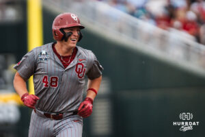 Oklahoma Sooners Deiten Lachance (48) celebrates a home run during the first inning of a CWS game on June 20, 2026, in Omaha, Nebraska. Photo by Brandon Tiedemann.