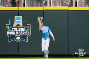 North Carolina Tar Heels Carter French (18) catches a pop fly during the third inning of a CWS game on June 20, 2026, in Omaha, Nebraska. Photo by Brandon Tiedemann.