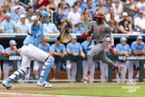 Oklahoma Sooner outfielder Dasan Harris (17) scores a run in the fourth inning against the North Carolina Tar Heels during the Finals of the College World Series baseball tournament on Saturday, June 20, 2026, in Omaha, Neb. Photo by John S. Peterson.