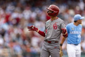 Oklahoma Sooner Kyle Branch (6) celebrates stealing second against the North Carolina Tar Heels during the Finals of the College World Series baseball tournament on Saturday, June 20, 2026, in Omaha, Neb. Photo by John S. Peterson.