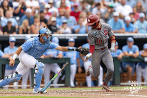 Oklahoma Sooner catcher Brendan Brock (10) tagged out by North Carolina Tar Heel catcher Colin Hynek (23) in the fifth inning during the Finals of the College World Series baseball tournament on Saturday, June 20, 2026, in Omaha, Neb. Photo by John S. Peterson.