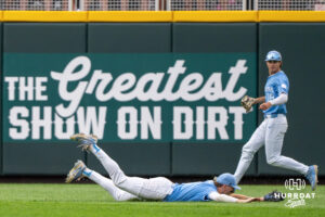 North Carolina Tar Heels Owen Hull (8) dives for a ball during the fifth inning a CWS game on June 20, 2026, in Omaha, Nebraska. Photo by Brandon Tiedemann.