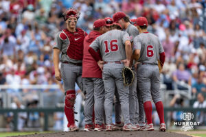 Oklahoma Sooner head coach Skip Johnson meets on the mound against the North Carolina Tar Heels in the fifith inning during the Finals of the College World Series baseball tournament on Saturday, June 20, 2026, in Omaha, Neb. Photo by John S. Peterson.