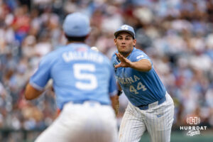 North Carolina Tar Heel first baseman Erik Paulsen (44) tosses the ball to the second baseman Gavin Gallaher for an out at first against the Oklahoma Sooners during the Finals of the College World Series baseball tournament on Saturday, June 20, 2026, in Omaha, Neb. Photo by John S. Peterson.