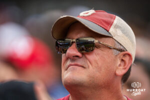 An Oklahoma Sooners fan watches during a CWS game on June 20, 2026, in Omaha, Nebraska. Photo by Brandon Tiedemann.