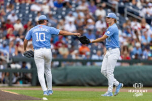 North Carolina Tar Heel pitcher Tom Chmielewski (10) hands the ball over to Cameron Padgett in the ninth inning during the Finals of the College World Series baseball tournament on Saturday, June 20, 2026, in Omaha, Neb. Photo by John S. Peterson.