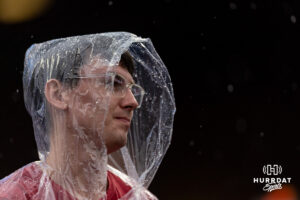 Oklahoma Sooner fan wears a rain poncho in the rain in the game against the North Carolina Tar Heels during the Finals of the College World Series baseball tournament on Saturday, June 20, 2026, in Omaha, Neb. Photo by John S. Peterson.