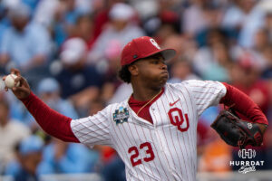 Oklahoma Sooners Xander Mercurius (23) pitches during the first inning of a CWS game on June 21, 2026, in Omaha, Nebraska. Photo by Brandon Tiedemann.