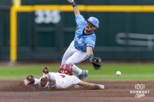 Oklahoma Sooner infielder Camden Johnson (9) steals second against North Carolina Tar Heel infielder Gavin Gallaher (5) in the first inning during game two of the Finals of the College World Series baseball tournament on Sunday, June 21, 2026, in Omaha, Neb. Photo by John S. Peterson.