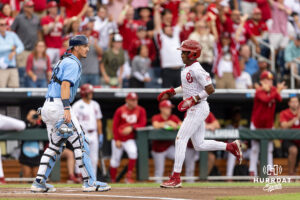 Oklahoma Sooner outfielder Jason Walk (1) scores a run in the first inning North Carolina Tar Heels during game two of the Finals of the College World Series baseball tournament on Sunday, June 21, 2026, in Omaha, Neb. Photo by John S. Peterson.
