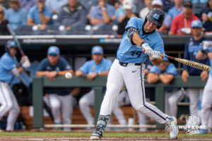 North Carolina Tar Heels Erik Paulsen (44) hits the ball during the second inning of a CWS game on June 21, 2026, in Omaha, Nebraska. Photo by Brandon Tiedemann.