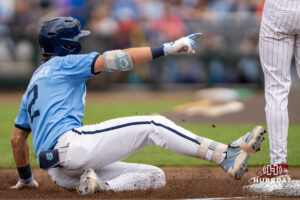 North Carolina Tar Heels Jake Schaffner (2) slides into third base during the third inning of a CWS game on June 21, 2026, in Omaha, Nebraska. Photo by Brandon Tiedemann.