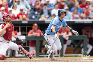 North Carolina Tar Heel infielder Jake Schaffner (2) hits a two-run triple against the Oklahoma Sooners in the third inning during game two of the Finals of the College World Series baseball tournament on Sunday, June 21, 2026, in Omaha, Neb. Photo by John S. Peterson.