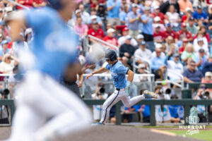 North Carolina Tar Heel outfielder Carter French (18) rounds third for home as Schaffner rounds first for his triple in the third inning during game two of the Finals of the College World Series baseball tournament on Sunday, June 21, 2026, in Omaha, Neb. Photo by John S. Peterson.