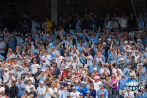North Carolina Tar Heel fans cheer during a CWS game on June 21, 2026, in Omaha, Nebraska. Photo by Brandon Tiedemann.