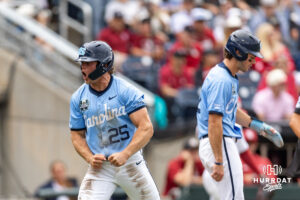 North Carolina Tar Heel outfielder Rom Kellis (25) celebraes scoring a run against the Oklahoma Sooners in the third inning during game two of the Finals of the College World Series baseball tournament on Sunday, June 21, 2026, in Omaha, Neb. Photo by John S. Peterson.