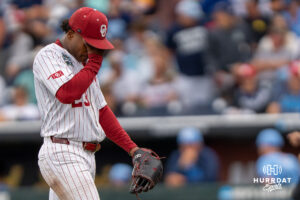 Oklahoma Sooners Xander Mercurius (23) walks to the dugout during the third inning of a CWS game on June 21, 2026, in Omaha, Nebraska. Photo by Brandon Tiedemann.