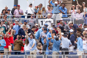 North Carolina Tar Heels fans celebrate and look for the home run ball from Owen Hull in the fifth innning during game two of the Finals of the College World Series baseball tournament on Sunday, June 21, 2026, in Omaha, Neb. Photo by John S. Peterson.