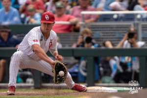 Oklahoma Sooners Dayton Tockey (16) scoops a ground ball during the seventh inning of a CWS game on June 21, 2026, in Omaha, Nebraska. Photo by Brandon Tiedemann.