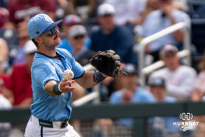 North Carolina Tar Heels Gavin Gallaher (5) throws to first base during the seventh inning of a CWS game on June 21, 2026, in Omaha, Nebraska. Photo by Brandon Tiedemann.