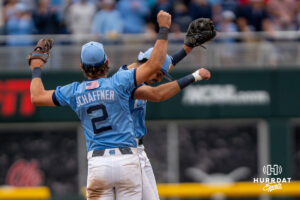 North Carolina Tar Heels Jake Schaffner (2) and Gavin Gallaher (5) chest bump after a CWS game on June 21, 2026, in Omaha, Nebraska. Photo by Brandon Tiedemann.