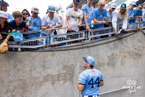 North Carolina Tar Heel utility Erik Paulsen (44) signs autographs and talks to the fans after the win against the Oklahoma Sooners during game two of the Finals of the College World Series baseball tournament on Sunday, June 21, 2026, in Omaha, Neb. Photo by John S. Peterson.