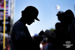 Oklahoma Sooner signs an autograph before the game against the North Carolina Tar Heels during game three of the Finals of the College World Series baseball tournament on Monday, June 22, 2026, in Omaha, Neb. Photo by John S. Peterson.