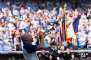 Brian Corey playes the National Anthem on his trumpet before Oklahoma and North Coralina play during game three of the Finals of the College World Series baseball tournament on Monday, June 22, 2026, in Omaha, Neb. Photo by John S. Peterson.