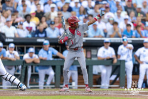 Oklahoma Sooner Jason Walk (1) waves in Dayton Tockey after a passed ball against the North Carolina Tar Heels in the second inning during game three of the Finals of the College World Series baseball tournament on Monday, June 22, 2026, in Omaha, Neb. Photo by John S. Peterson.