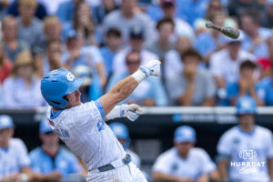 The bat slips from North Carolina Tar Heel Cooper Nicholson (1) grip in the second inning against the Oklahoma Sooners during game three of the Finals of the College World Series baseball tournament on Monday, June 22, 2026, in Omaha, Neb. Photo by John S. Peterson.
