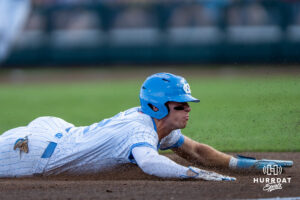 North Carolina Tar Heels Owen Hull (8) slides into third base during the third inning of a CWS game on June 22, 2026, in Omaha, Nebraska. Photo by Brandon Tiedemann.