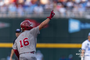 Oklahoma Sooner infielder Dayton Tockey (16) waves to the bullpen after hitting a home run against the North Carolina Tar Heels in the fifth inning during game three of the Finals of the College World Series baseball tournament on Monday, June 22, 2026, in Omaha, Neb. Photo by John S. Peterson.