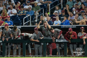 The Oklahoma Sooners cheers during the eigth inning of a CWS game on June 22, 2026, in Omaha, Nebraska. Photo by Brandon Tiedemann.