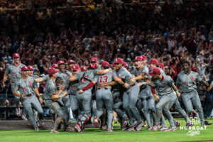 The Oklahoma Sooners celebrate winning a CWS game on June 22, 2026, in Omaha, Nebraska. Photo by Brandon Tiedemann.