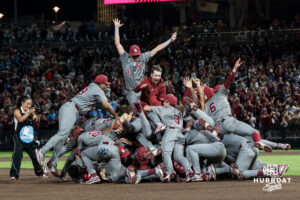 The Oklahoma Sooners dogpile after a CWS game on June 22, 2026, in Omaha, Nebraska. Photo by Brandon Tiedemann.