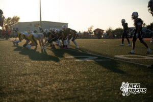 Athletes compete during a game on an outdoor field.