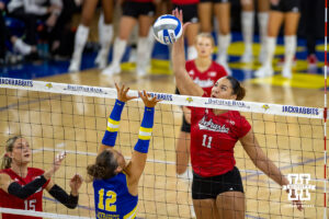 Teraya Sigler spikes the ball against South Dakota State. Photo by John S. Peterson.