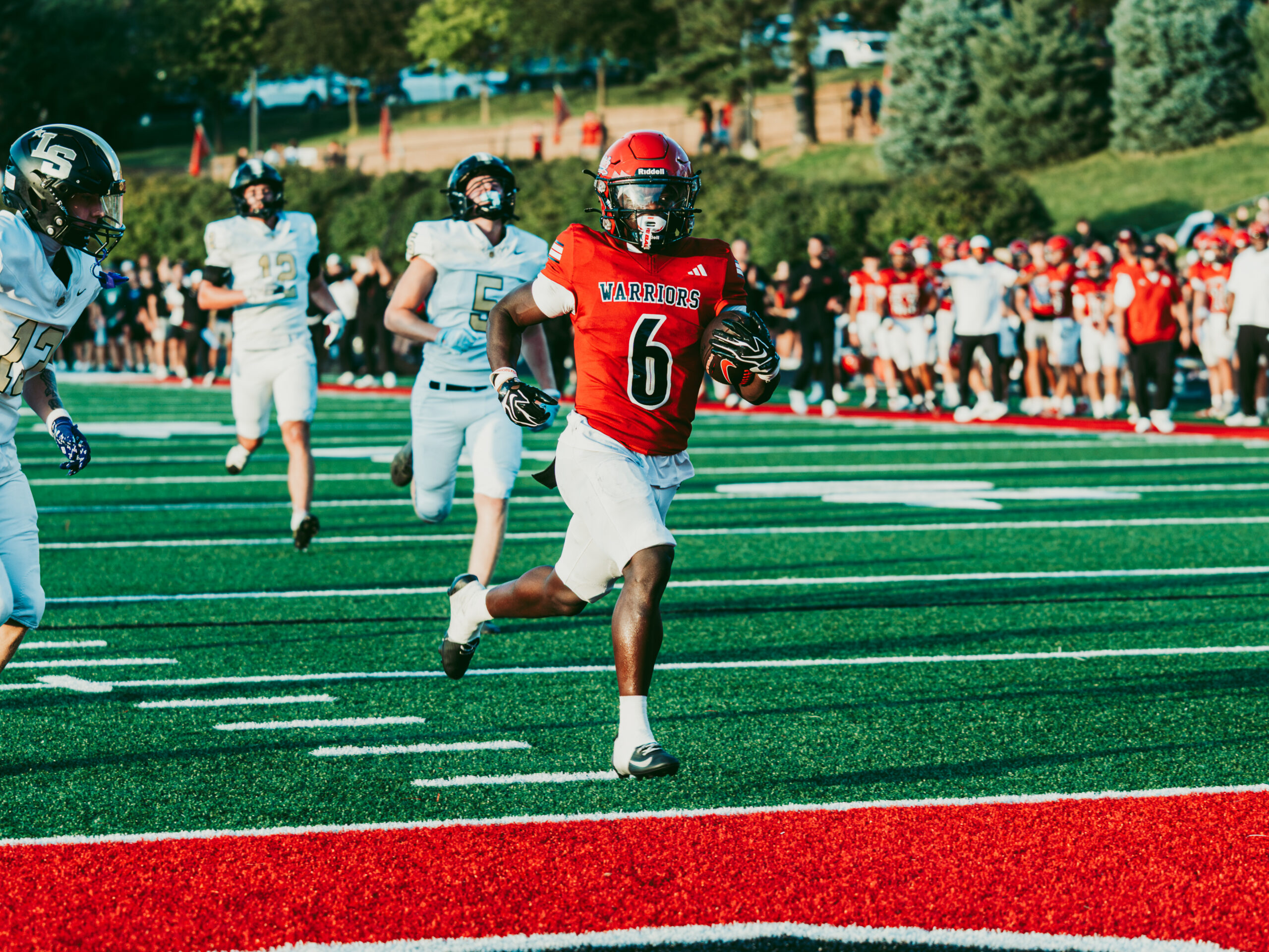 DSC05712-2 Omaha Westside senior running back Tay Tay Jenkins scores a touchdown against Lee's Summit (Mo.). Photo by Koby Meyers.