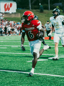 Omaha Westside senior running back Tay Tay Jenkins scores a touchdown against Lee's Summit (Mo.). Photo by Koby Meyers.
