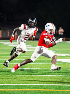 Millard South senior safety/running back Aidan Marshall carries the ball against Lee's Summit (Mo.) North. Photo by Wyatt Carmichael.
