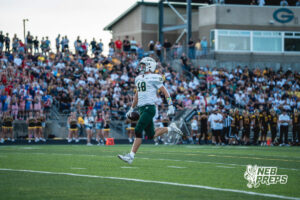 Henry Hildebrand (18) strolls into the end zone scoring during a high school football game Friday, September 11, 2026, in Gretna, Nebraska. Photo by Robert Olvera