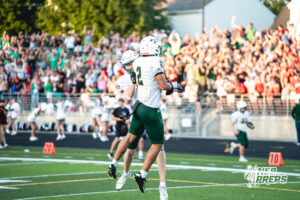 Talon Daharsh (2) and Blake Skiles (5) celebrate after scoring during a high school football game between the Griffins and Dragons Friday, September 11, 2026, in Gretna, Nebraska. Photo by Robert Olvera