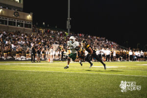 Talon Daharsh (2) crosses the end zone during a high school football game between the Griffins and Dragons Friday, September 11, 2026, in Gretna, Nebraska. Photo by Robert Olvera
