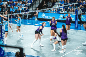 Addison Massey (15) hypes up the crowd and team after a point in an away game against the Creighton Bluejays on September 18, 2026 in Omaha, Nebraska. Photo by Rob Olvera.